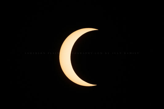 Celestial photography print of a crescent shaped sun as the moon passes through during an annular eclipse in Oklahoma by Sean Ramsey of Southern Plains Photography.