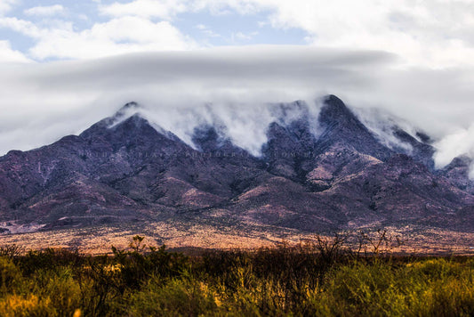 Desert peaks photography print of clouds falling over the Organ Mountains on an early spring day in New Mexico by Sean Ramsey of Southern Plains Photography.