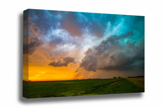 Thunderstorm canvas wall art of colorful storm clouds over a field at sunset on a stormy spring evening in Kansas by Sean Ramsey of Southern Plains Photography.