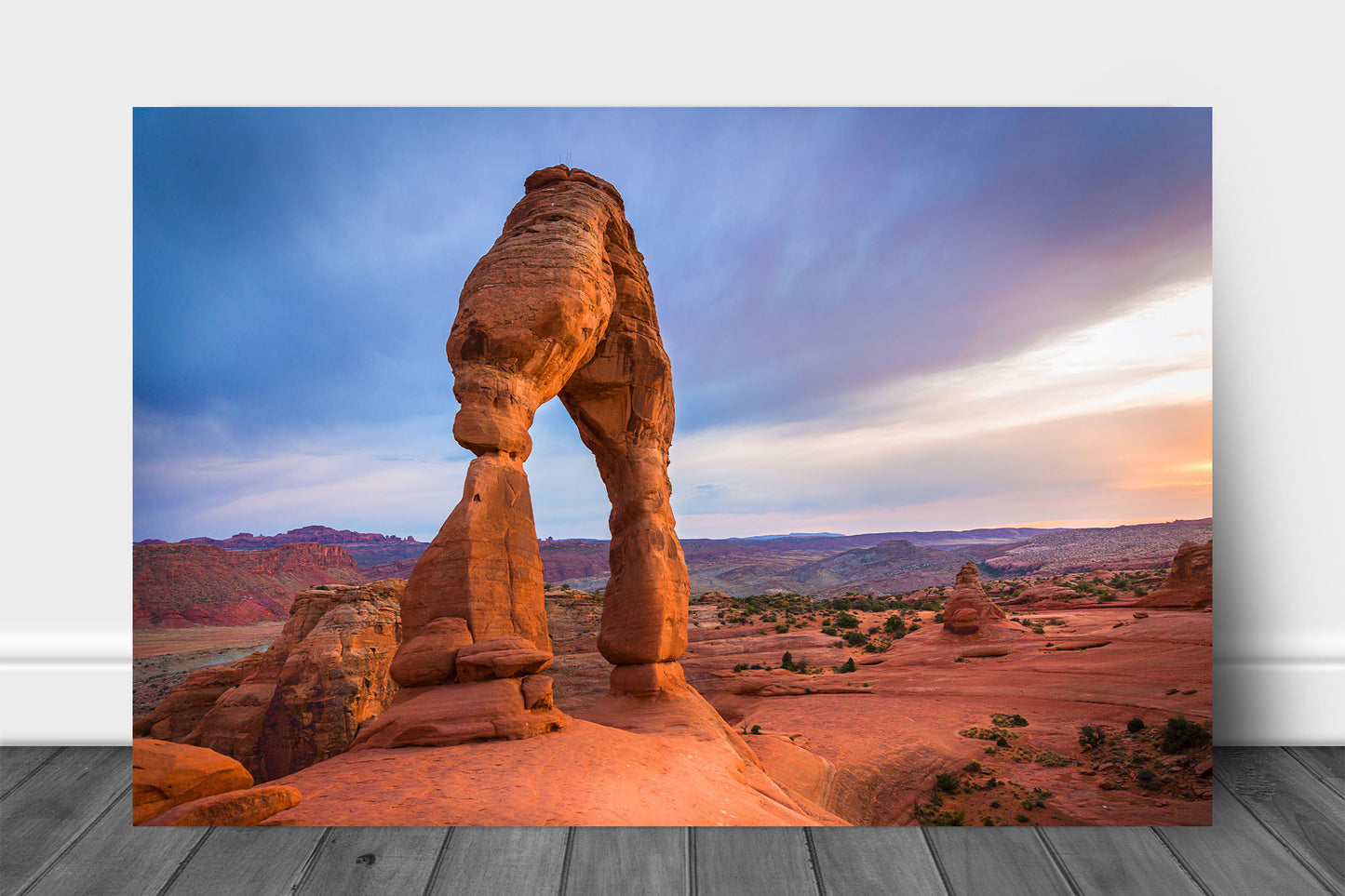 Western landscape metal print of Delicate Arch glowing in evening sunlight at sunset in Arches National Park near Moab, Utah by Sean Ramsey of Southern Plains Photography.