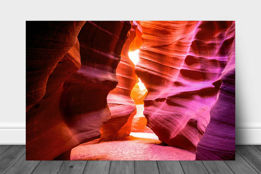Southwestern metal print of Antelope Canyon walls shaped as an hourglass leading to sunlight in the Arizona desert by Sean Ramsey of Southern Plains Photography.