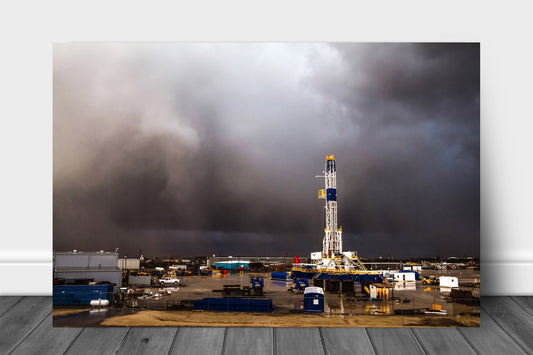 Oil and gas metal print of a drilling rig standing tall in an intense storm as it passes through on a spring day in Oklahoma by Sean Ramsey of Southern Plains Photography.