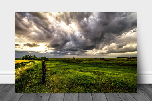 Great Plains metal print of golden sunlight filtering through storm clouds and shining down on the Nebraska prairie by Sean Ramsey of Southern Plains Photography.