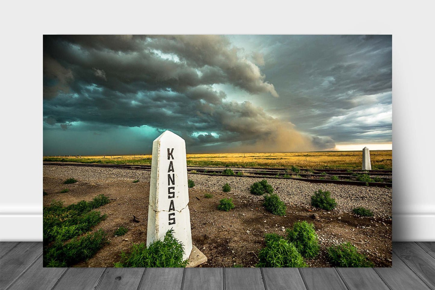 Great Plains metal print of a storm advancing past a railroad post on a spring day at the state line of Colorado and Kansas by Sean Ramsey of Southern Plains Photography.