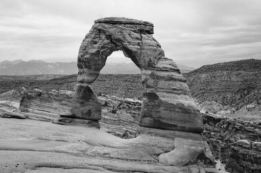 Black and white western landscape photography print of Delicate Arch in Arches National Park near Moab, Utah by Sean Ramsey of Southern Plains Photography.