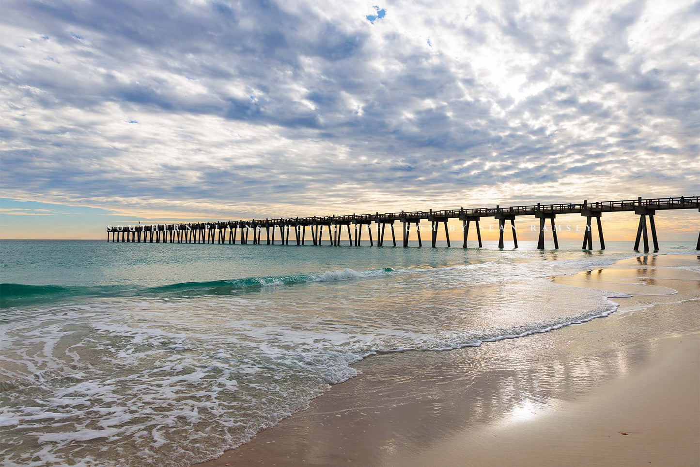 Gulf Coast photography print of the Pensacola Beach Pier over emerald waters on an evening in Florida by Sean Ramsey of Southern Plains Photography.