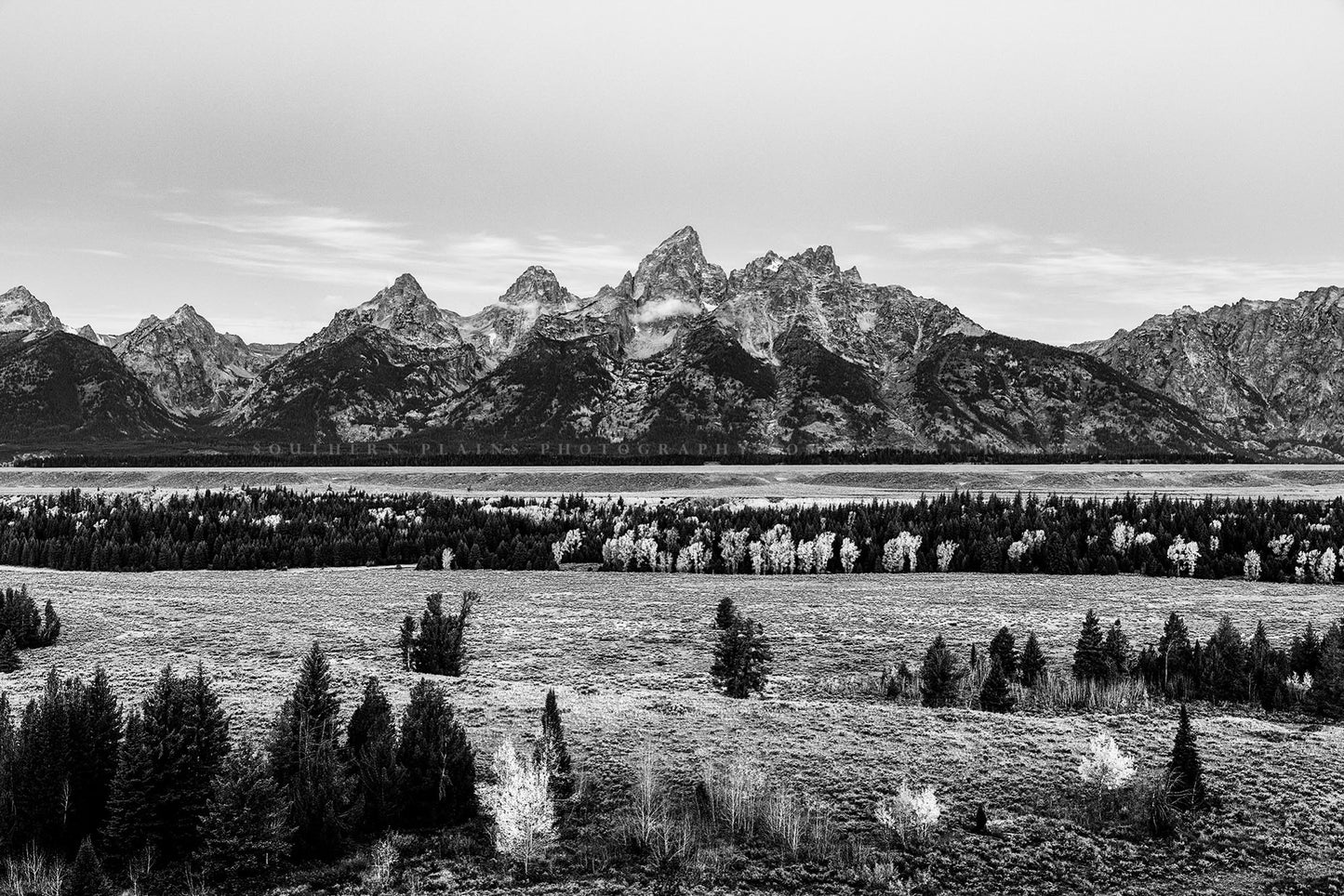 Black and white Rocky Mountain landscape photography print of Grand Teton rising above the valley floor on an autumn morning in Grand Teton National Park, Wyoming by Sean Ramsey of Southern Plains Photography.