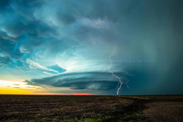 Storm photography print of a lightning bolt and supercell thunderstorm at sunset on a stormy spring evening in Kansas by Sean Ramsey of Southern Plains Photography.
