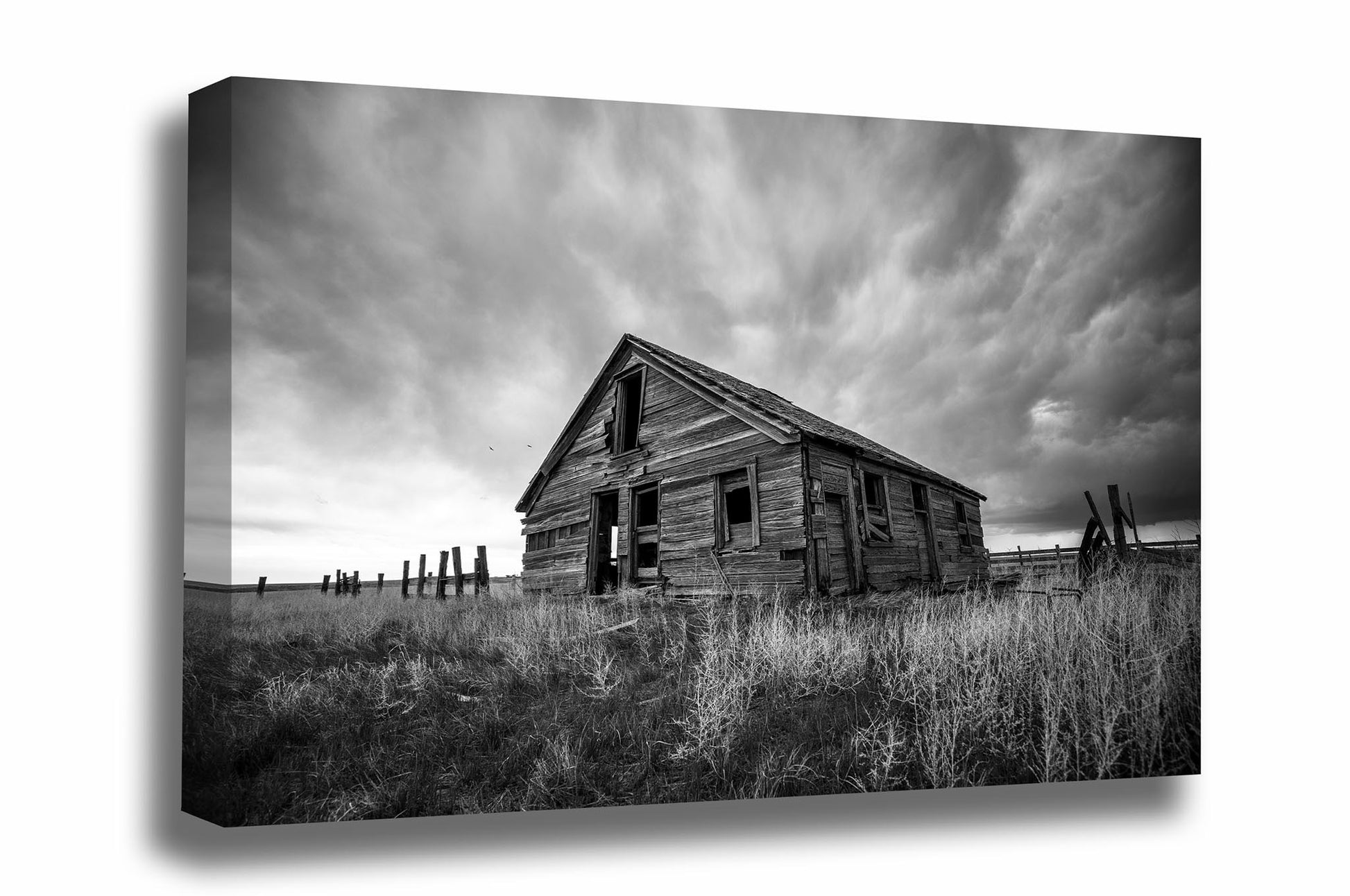 Black and white Great Plains canvas wall art of a rustic abandoned homestead on a stormy day on the Colorado prairie by Sean Ramsey of Southern Plains Photography.
