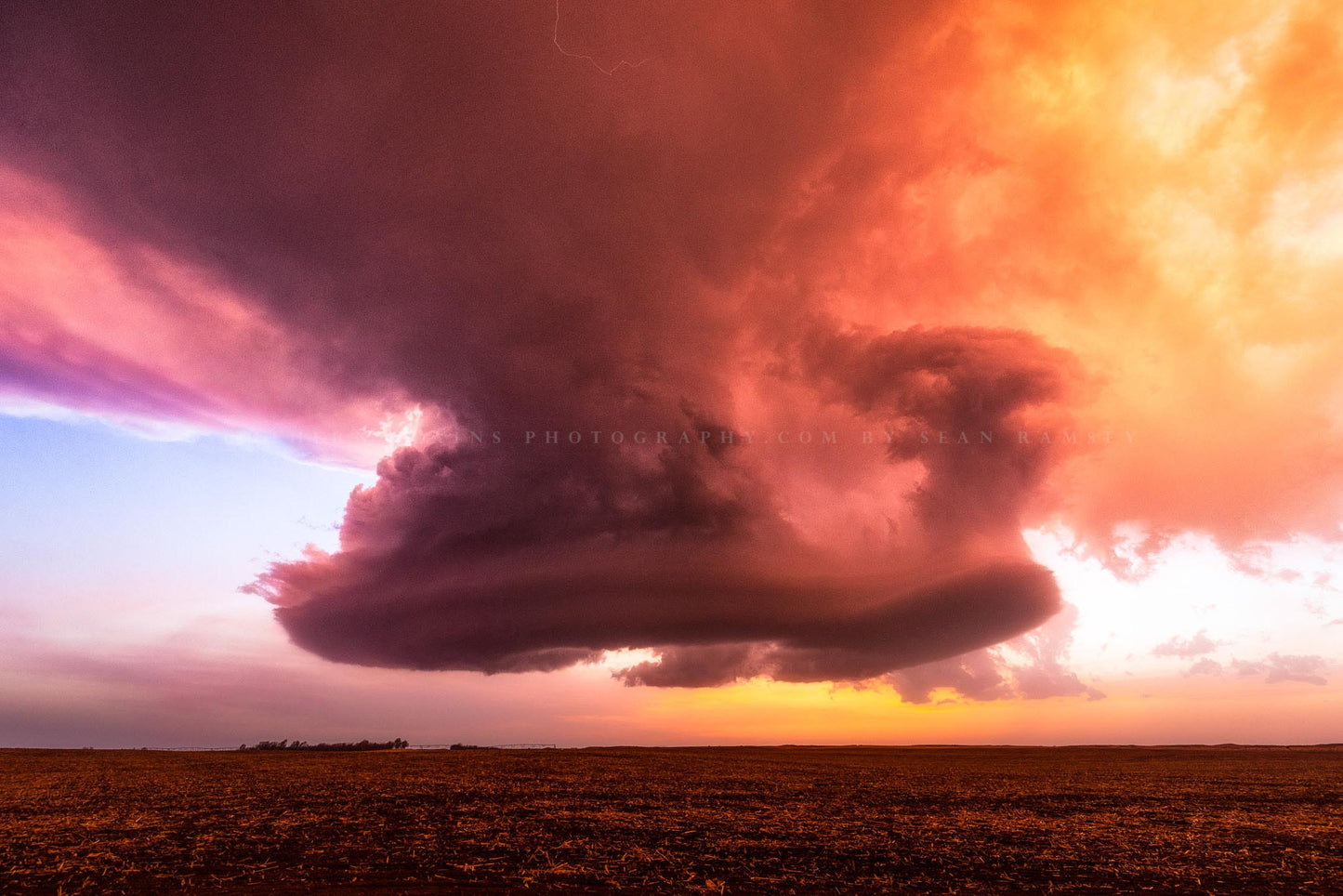 Storm photography print of a low precipitation supercell thunderstorm hovering over a field at sunset on a stormy spring evening in Kansas by Sean Ramsey of Southern Plains Photography.