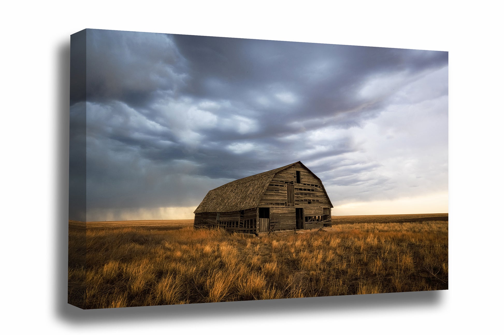 Great plains gallery wrapped canvas wall art of an old wooden barn standing alone in prairie grass under a stormy sky in Oklahoma by Sean Ramsey of Southern Plains Photography.