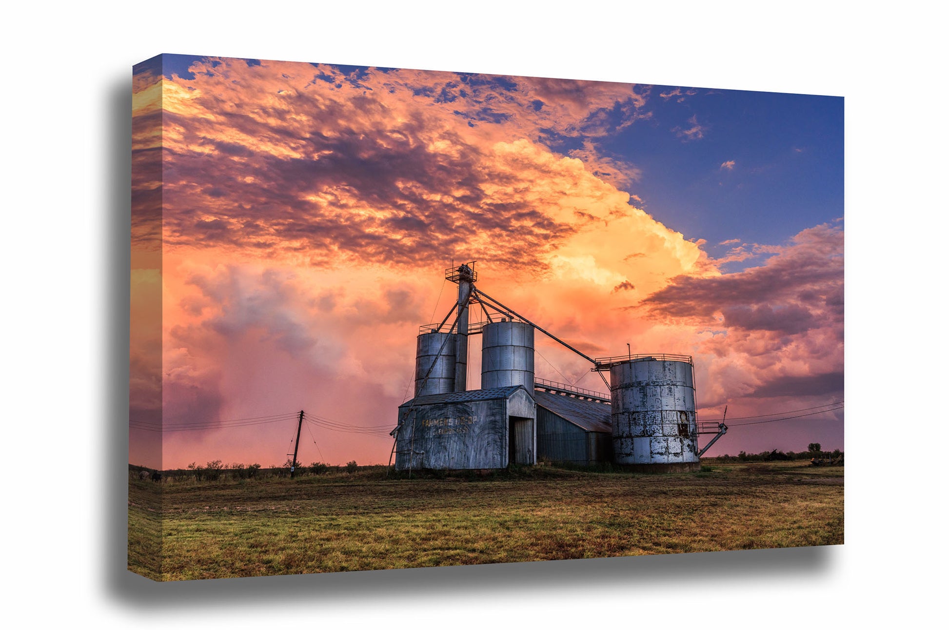 Farm and country canvas wall art of grain silos under a colorful stormy sky at sunset in a rural small town in Texas by Sean Ramsey of Southern Plains Photography.