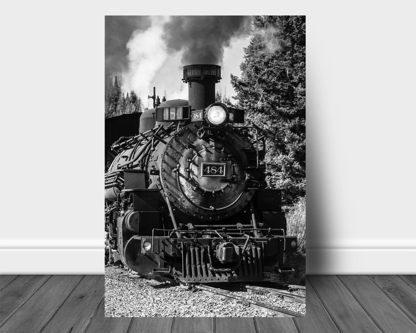 Vertical black and white train aluminum metal print wall art of a vintage style steam engine rolling down the tracks along a railroad in the mountains of Colorado by Sean Ramsey of Southern Plains Photography.