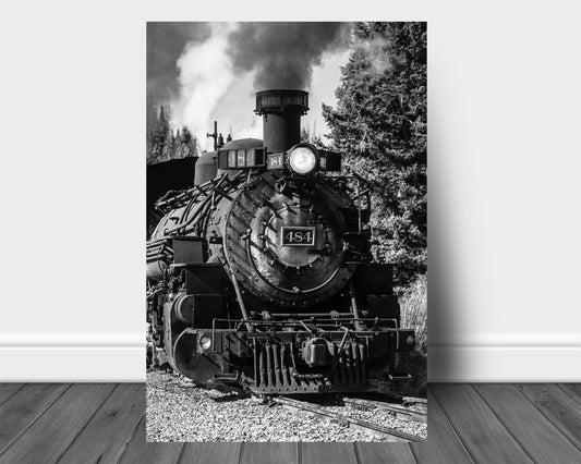 Vertical black and white train aluminum metal print wall art of a vintage style steam engine rolling down the tracks along a railroad in the mountains of Colorado by Sean Ramsey of Southern Plains Photography.