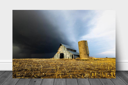 Country aluminum metal print wall art of a storm approaching an old barn and grain silo on a stormy spring day in Kansas by Sean Ramsey of Southern Plains Photography.