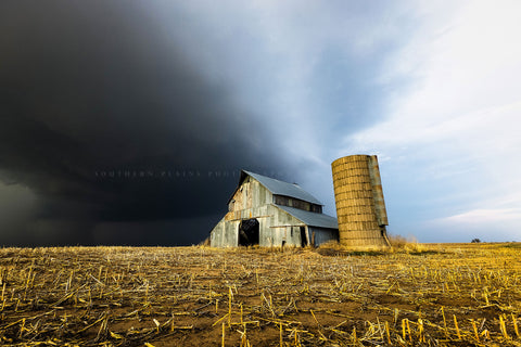 Country photography print of a storm approaching an old barn and grain silo on a stormy spring day in Kansas by Sean Ramsey of Southern Plains Photography.