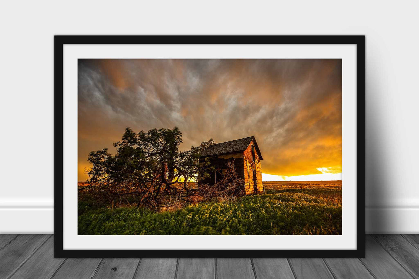 Framed and matted print of an old red barn and windswept tree under a stormy sky at sunset in Oklahoma by Sean Ramsey of Southern Plains Photography.