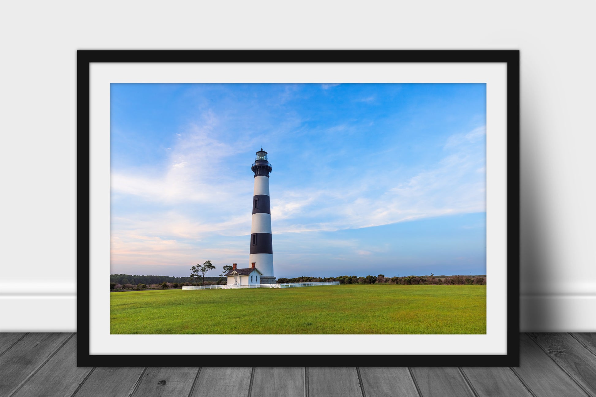 Framed and matted OBX print of the Bodie Island Lighthouse standing tall against a beautiful blue evening sky in the Outer Banks of North Carolina by Sean Ramsey of Southern Plains Photography.