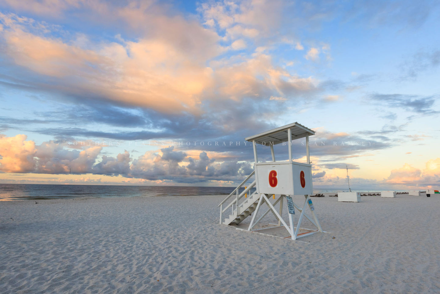 Gulf Coast photography print of a lifeguard tower under a serene sky at sunrise at Orange Beach, Alabama by Sean Ramsey of Southern Plains Photography.