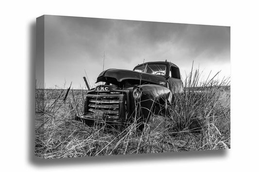 Black and white vintage style canvas wall art an abandoned classic pickup truck in a field on a rainy day in Oklahoma by Sean Ramsey of Southern Plains Photography.