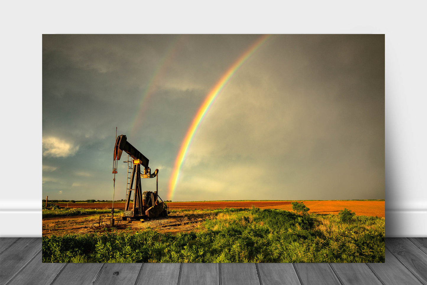 Oilfield metal print on aluminum of a brilliant rainbow ending at a pump jack on a stormy spring day in Texas by Sean Ramsey of Southern Plains Photography.