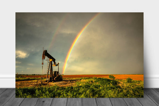 Oilfield metal print on aluminum of a brilliant rainbow ending at a pump jack on a stormy spring day in Texas by Sean Ramsey of Southern Plains Photography.