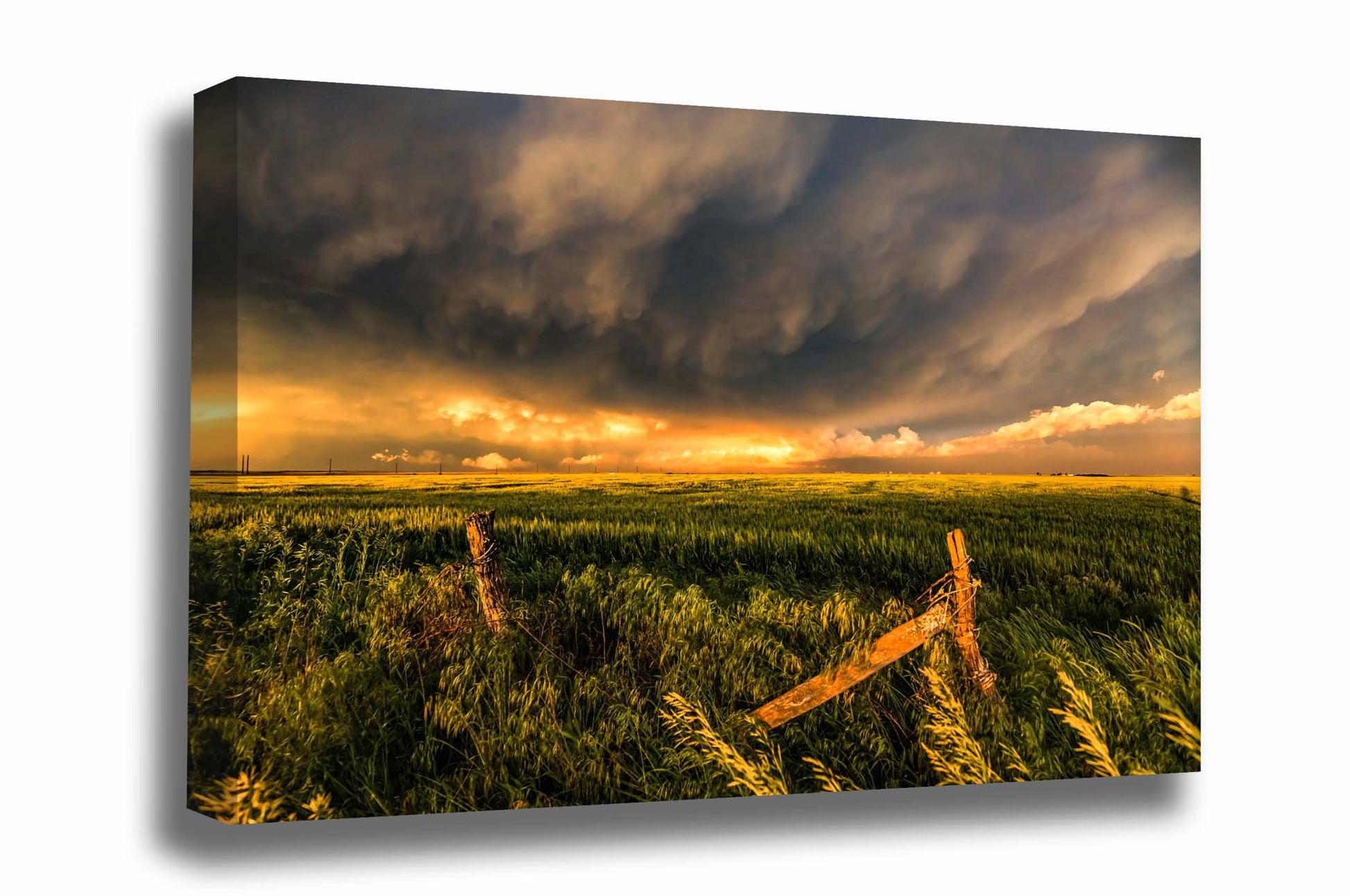 Great plains canvas wall art of storm clouds illuminated by sunlight over an old fence and field at sunset on a stormy evening in Kansas by Sean Ramsey of Southern Plains Photography.