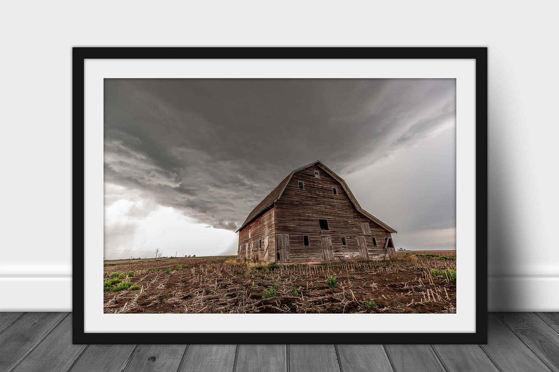Framed country print of a large red barn under an advancing thunderstorm on a stormy day in Nebraska by Sean Ramsey of Southern Plains Photography.