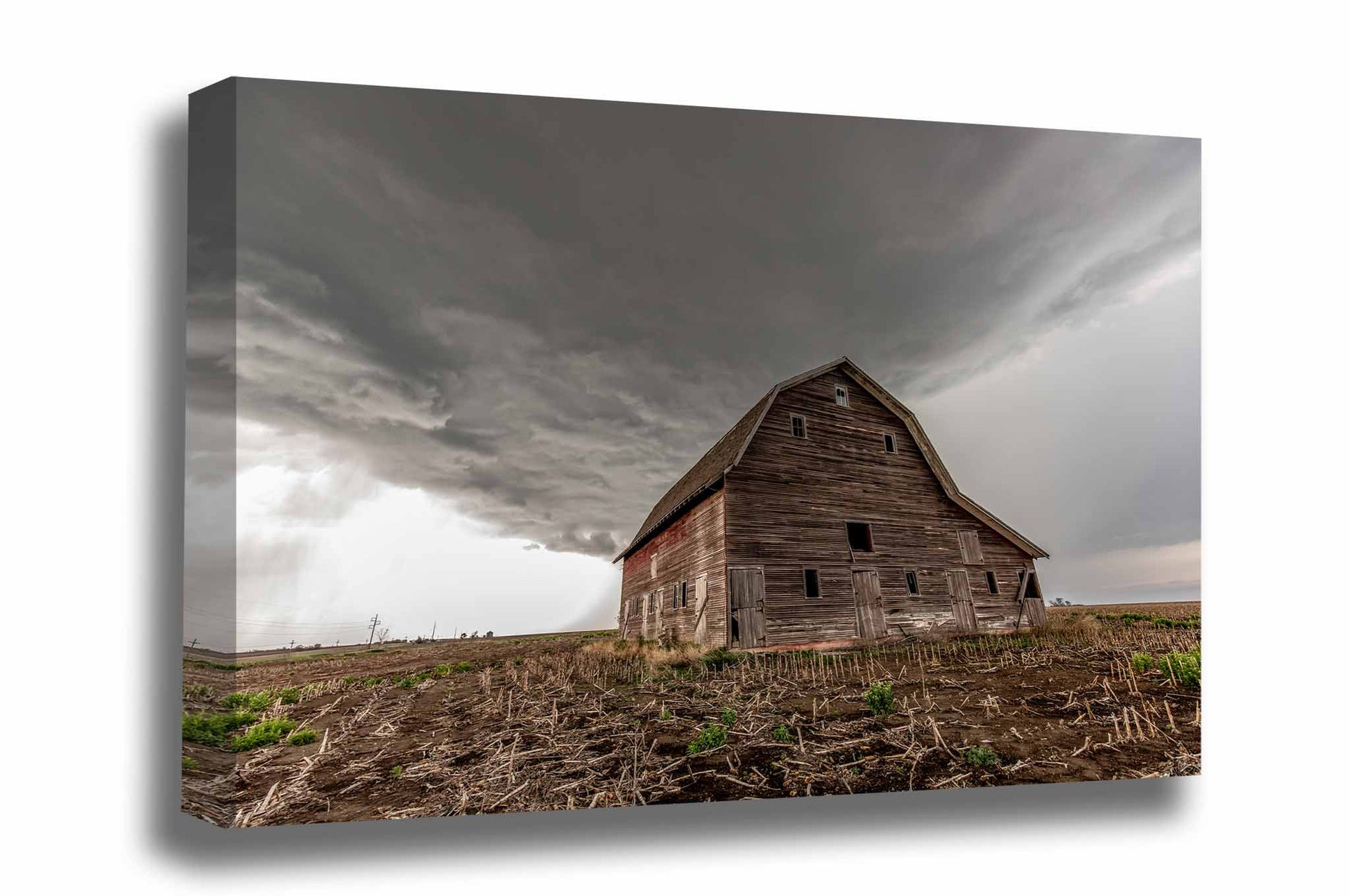 Farm canvas wall art of a thunderstorm approaching an Amish style barn in a field of corn stubble on a stormy spring day in Nebraska by Sean Ramsey of Southern Plains Photography. 