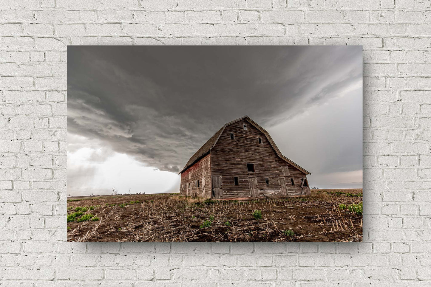 Country aluminum metal print of a storm advancing over an old red Amish style barn in a field on a stormy spring day in Nebraska by Sean Ramsey of Southern Plains Photography.