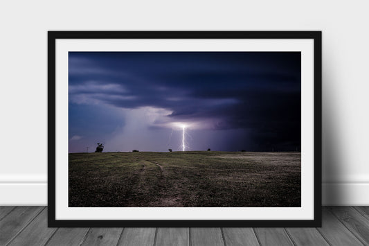 Framed and matted storm print of a branched lightning bolt striking open prairie on a stormy night in Oklahoma by Sean Ramsey of Southern Plains Photography.
