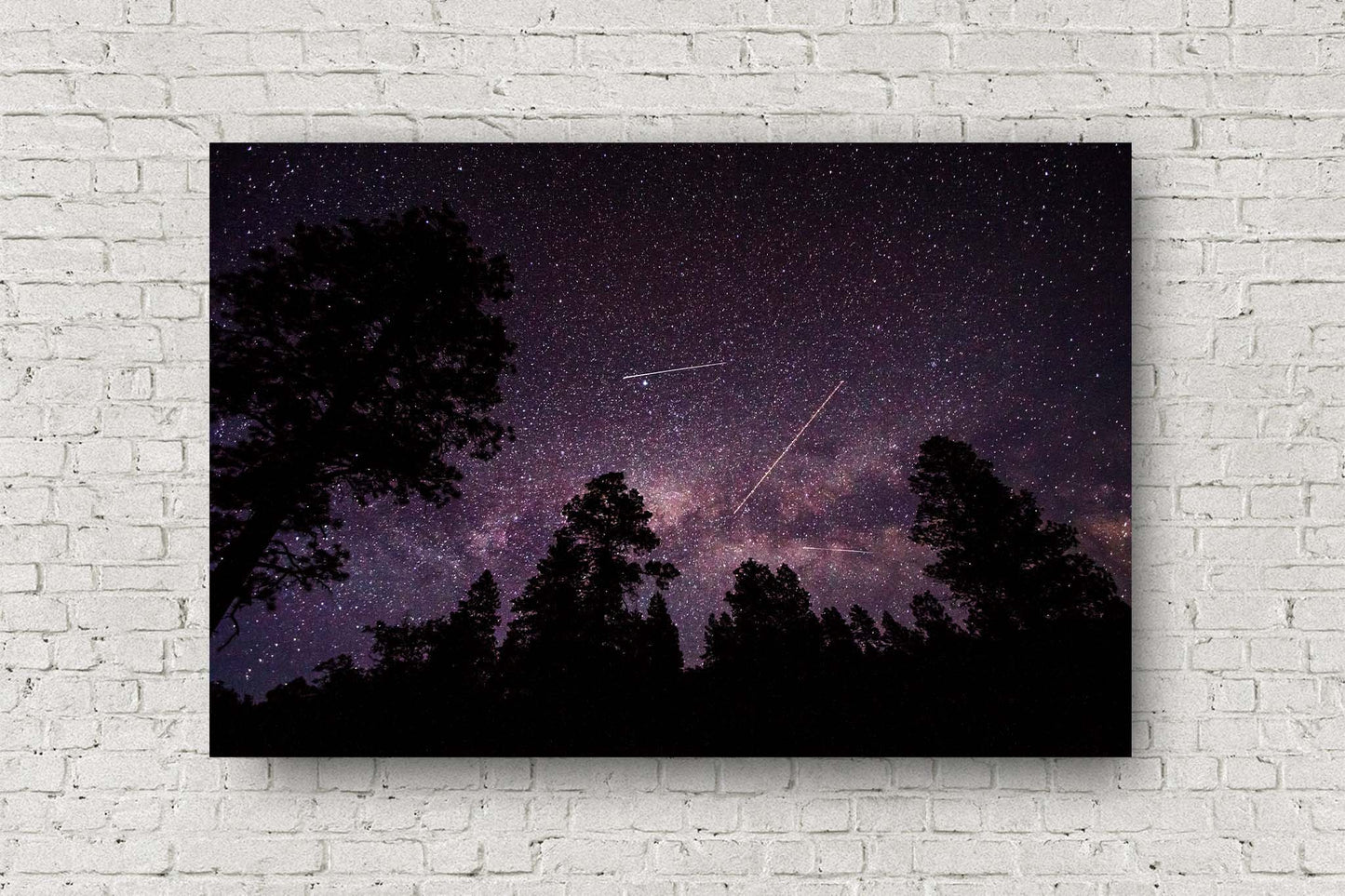 Celestial metal print of shooting stars, planes and satellites crossing the night sky in front of the Milky Way on a clear night in the Rocky Mountains of Colorado by Sean Ramsey of Southern Plains Photography.