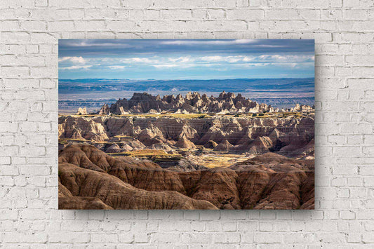 Western landscape aluminum metal print of spires rising up from the plains in Badlands National Park, South Dakota by Sean Ramsey of Southern Plains Photography.