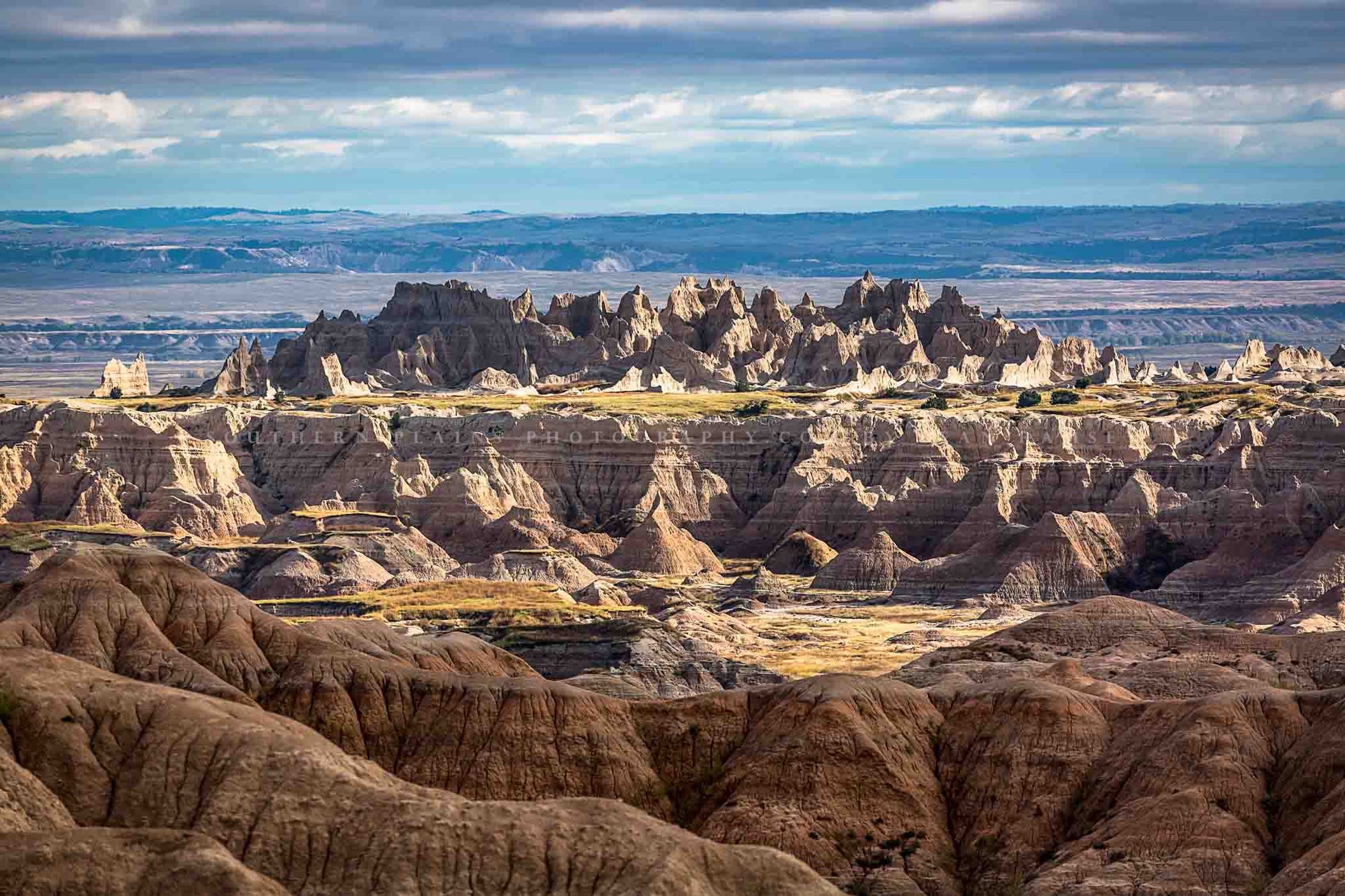 Landscape photography print of spires rising above the plains in Badlands National Park, South Dakota by Sean Ramsey of Southern Plains Photography.