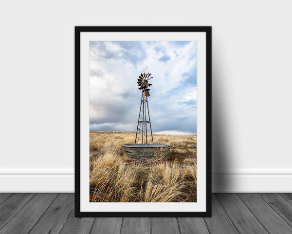 Framed and matted vertical country print of an old windmill and water tank nestled in prairie grass on an early spring day in Oklahoma by Sean Ramsey of Southern Plains Photography.