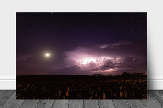 Storm aluminum metal print wall art of a supercell thunderstorm illuminated by lightning as a full moon shines bright in a starry night sky in Oklahoma by Sean Ramsey of Southern Plains Photography.