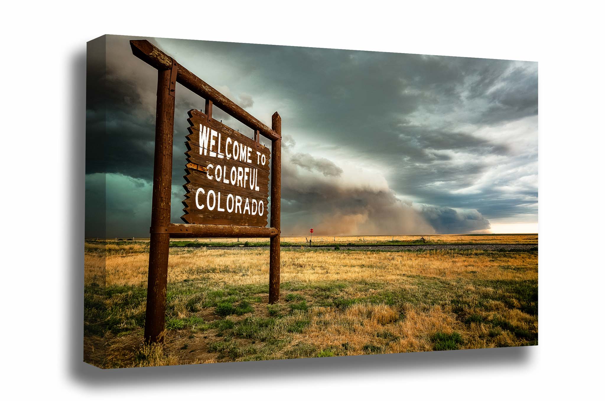 Great plains canvas wall art of a haboob thunderstorm advancing behind a Colorful Colorado state line sign on a spring day along the Colorado and Kansas border by Sean Ramsey of Southern Plains Photography.