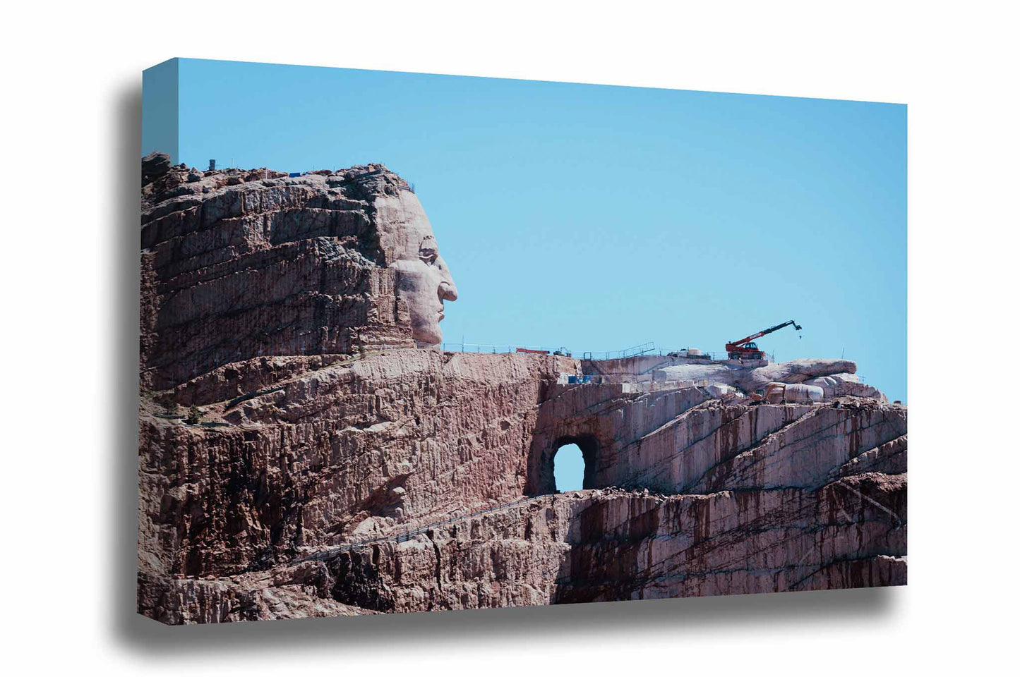 Black Hills canvas wall art of the Crazy Horse Memorial as it continues its progress against a blue sky in South Dakota by Sean Ramsey of Southern Plains Photography.