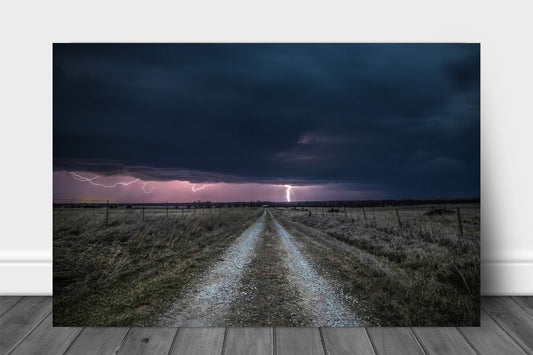 Storm metal print on aluminum of lightning striking down an old country road on a stormy night in Kansas by Sean Ramsey of Southern Plains Photography.