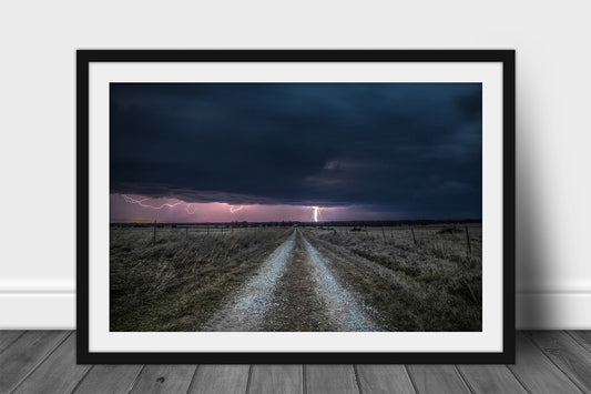 Framed and matted storm print of lightning striking down a country road on a stormy night in Kansas by Sean Ramsey of Southern Plains Photography.