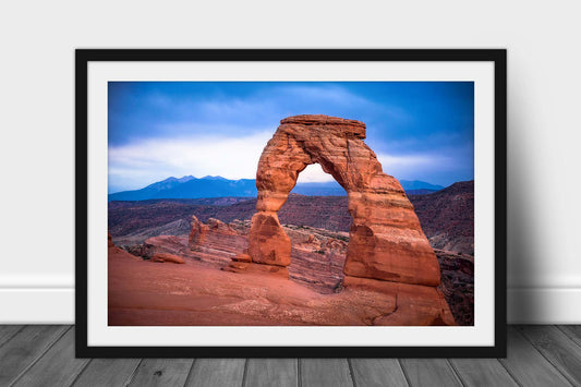 Framed western landscape print of the iconic Delicate Arch on a rainy evening in Arches National Park near Moab, Utah by Sean Ramsey of Southern Plains Photography.
