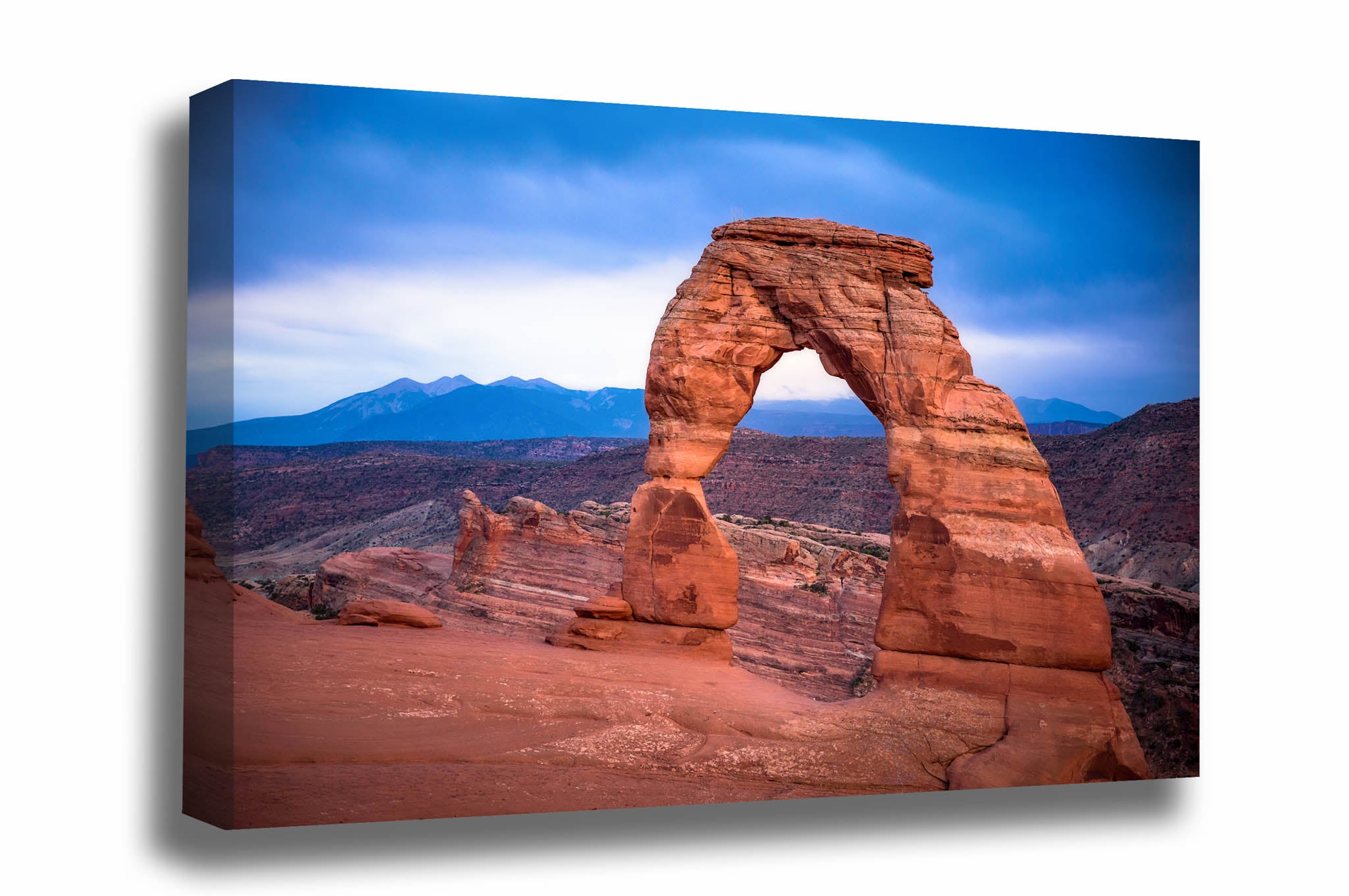 Western landscape canvas wall art of Delicate Arch on a rainy evening in the high desert in Arches National Park near Moab, Utah by Sean Ramsey of Southern Plains Photography.