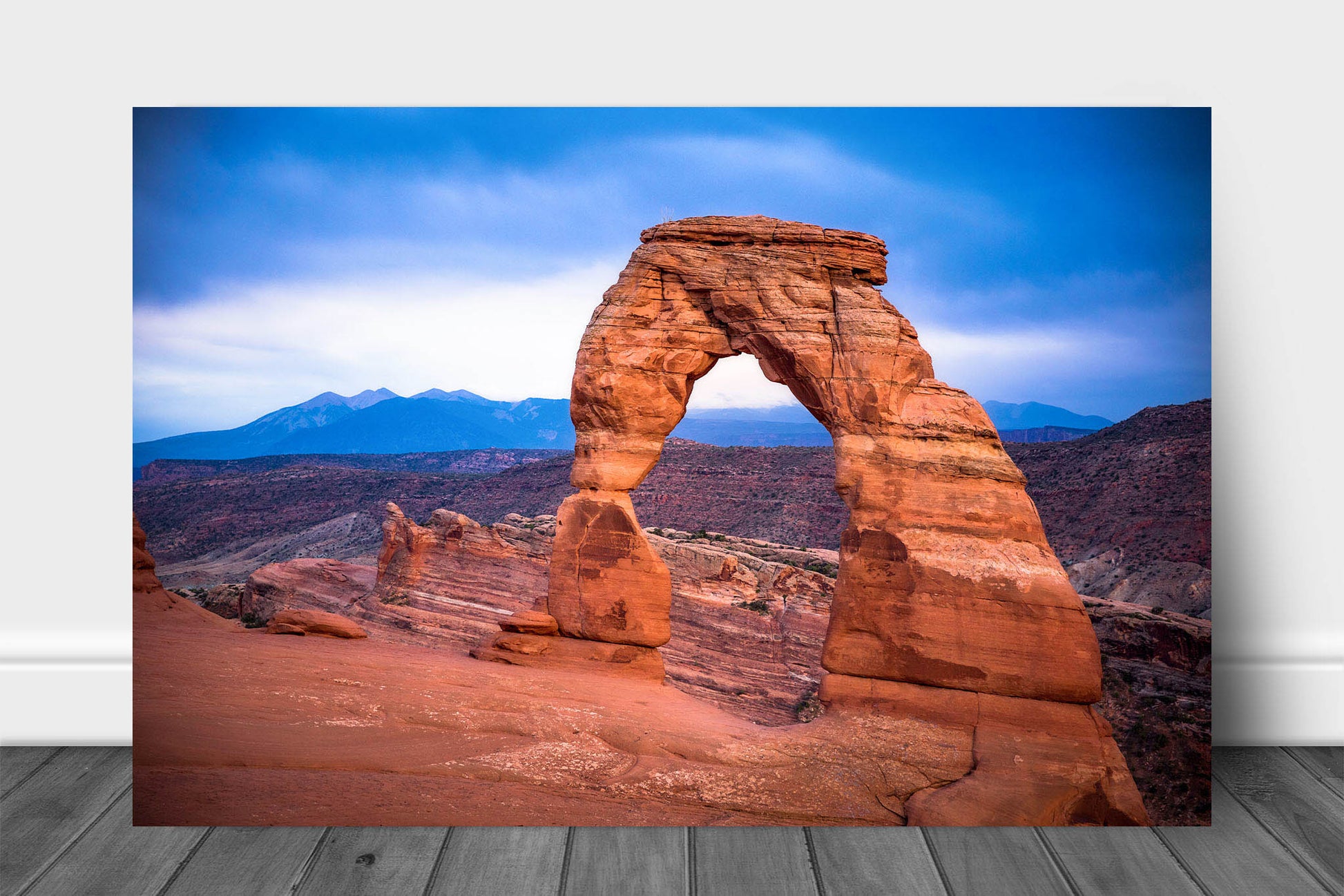 Landscape metal print of Delicate Arch glowing on a rainy evening in Arches National Park near Moab, Utah by Sean Ramsey of Southern Plains Photography.