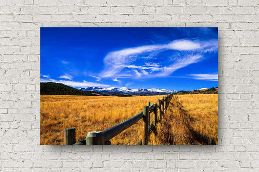 Rocky Mountain metal print on aluminum of a fence leading to snowy Bighorn Mountains on an autumn day in Wyoming by Sean Ramsey of Southern Plains Photography.