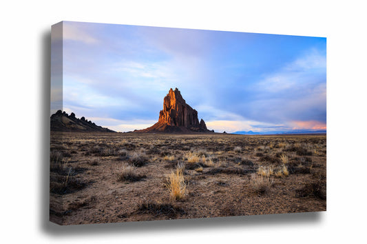 Southwestern landscape canvas wall art of Shiprock glowing in evening light at sunset in the Navajo lands near the Four Corners region of New Mexico by Sean Ramsey of Southern Plains Photography. 