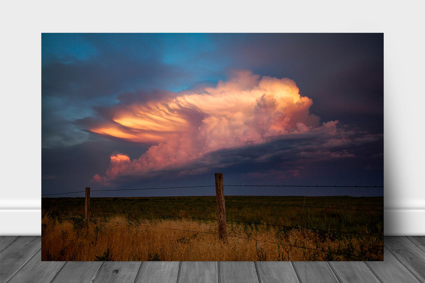 Storm metal print on aluminum of a supercell thunderstorm drenched in sunlight over a barbed wire fence at sunset on a stormy evening in Oklahoma by Sean Ramsey of Southern Plains Photography.