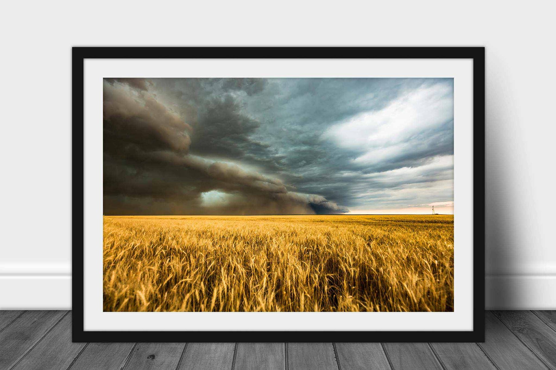 Framed storm print of a thunderstorm over a golden wheat field on a stormy spring day on the plains of Colorado by Sean Ramsey of Southern Plains Photography.