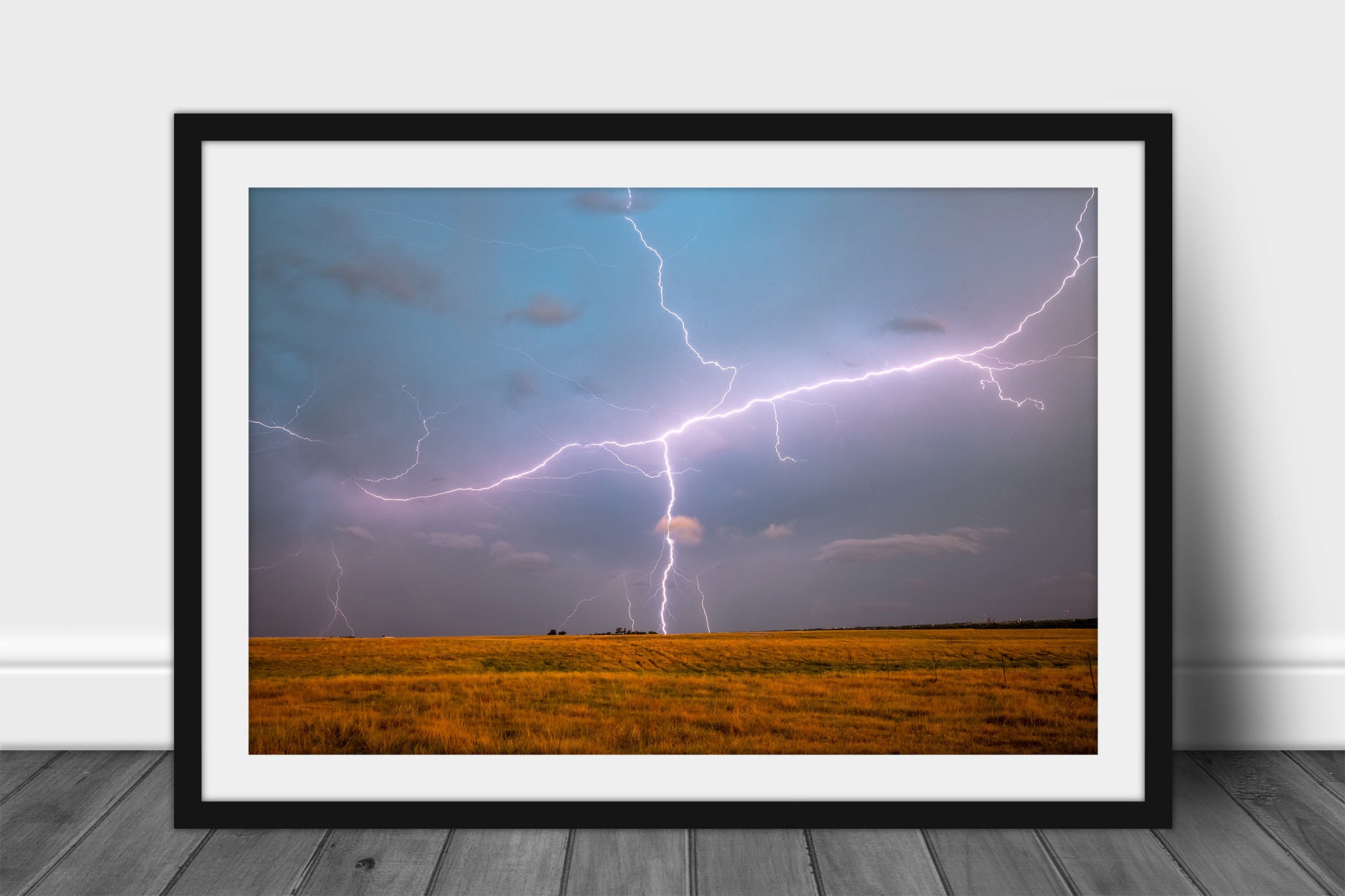 Framed and matted storm print of lightning spanning the sky over an open field on a stormy spring evening in Oklahoma by Sean Ramsey of Southern Plains Photography.