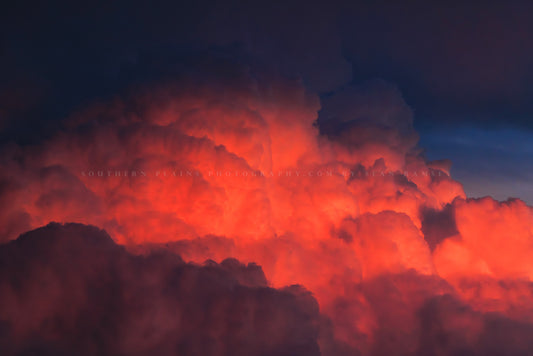 Stormy sky photography print of fiery red cumulonimbus storm clouds rising high into the sky at sunset on a stormy evening in Texas by Sean Ramsey of Southern Plains Photography.