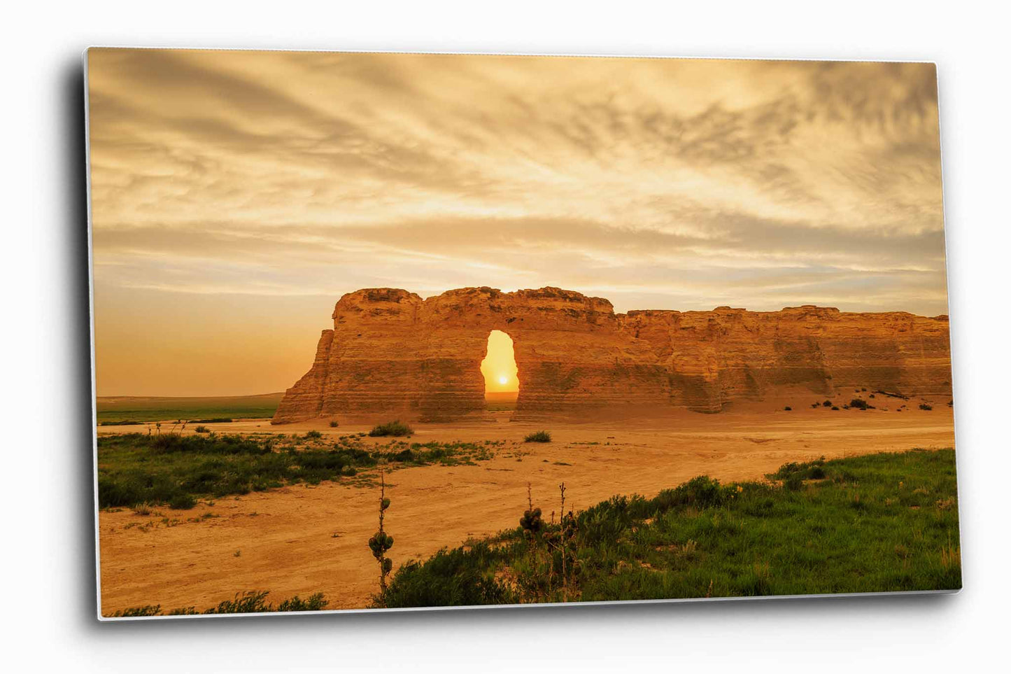 Great Plains aluminum metal print wall art of the sun setting through an opening on a stormy evening at Monument Rocks in Kansas by Sean Ramsey of Southern Plains Photography.